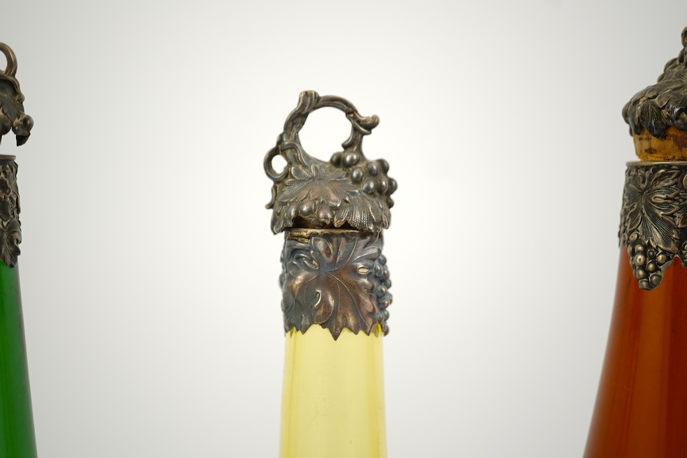 A composed set of six mid 19th century vari-coloured glass carafes